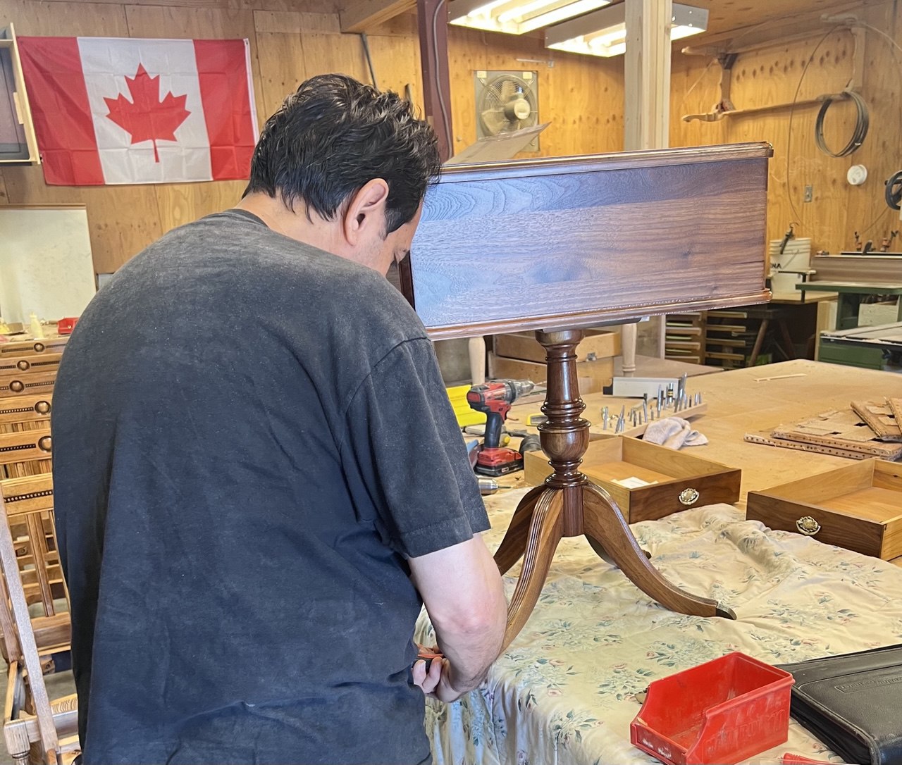 Skilled craftsmen precisely cutting wooden planks using a circular saw in a workshop, highlighting expert craftsmanship and attention to detail in woodworking