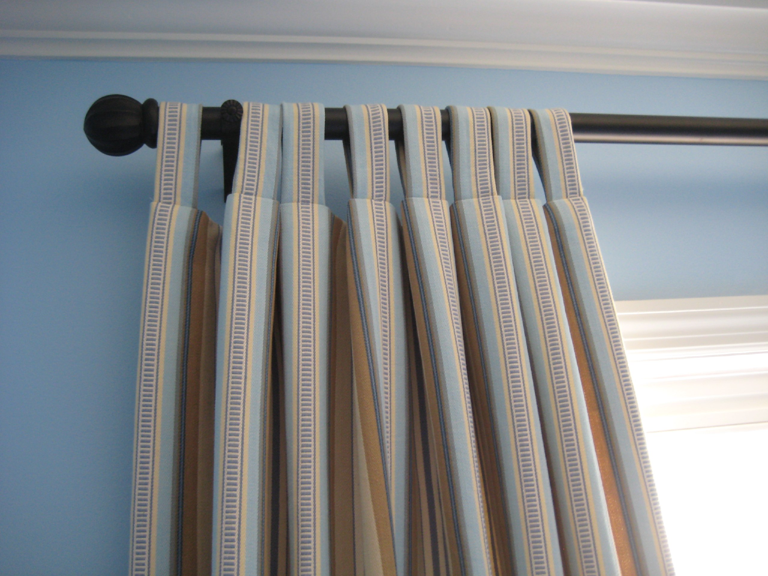 Add a relaxed, modern touch with our custom tab top curtains, featuring fabric loops for easy hanging. Personalize with your choice of fabric and length for a perfect fit.